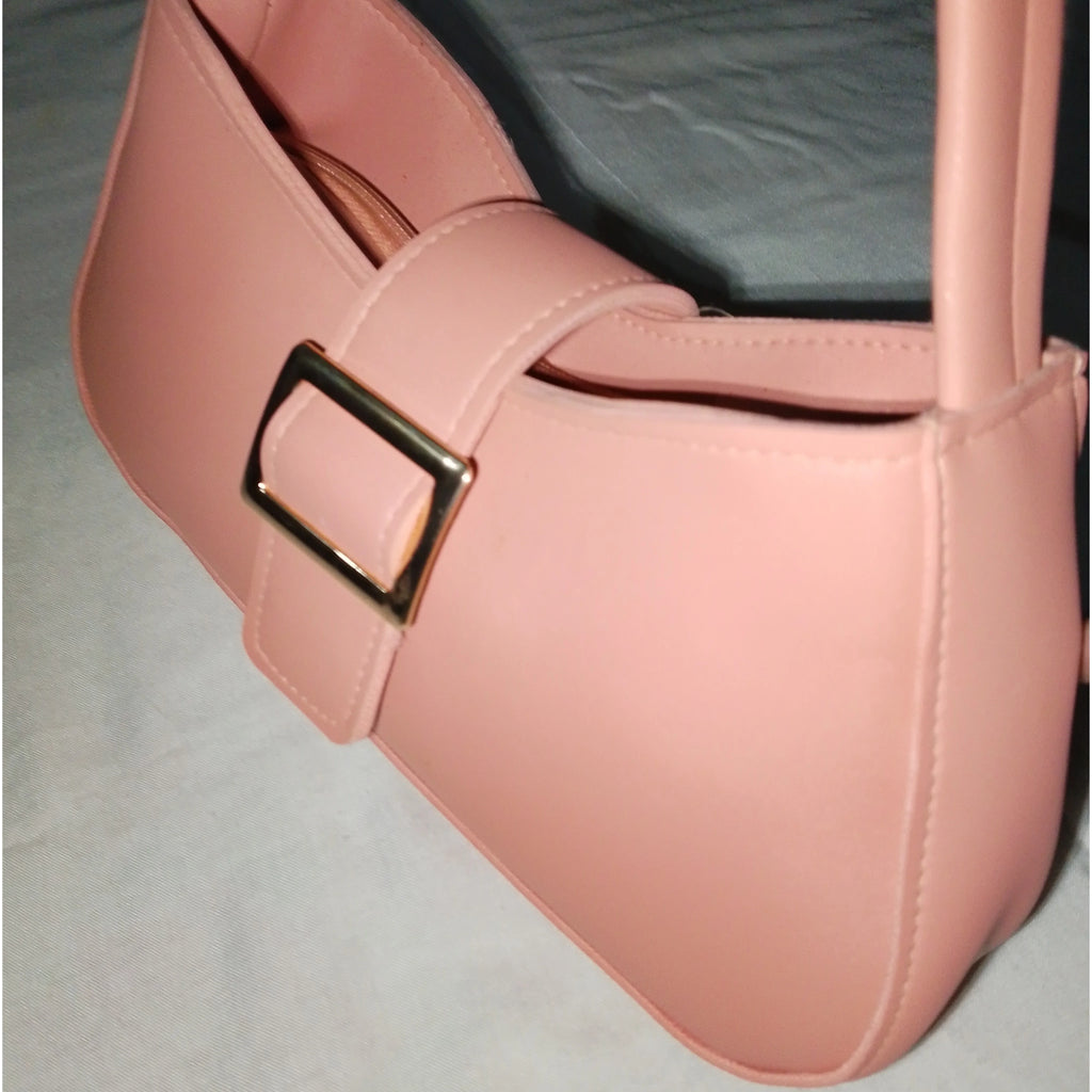 pink buckled handbag