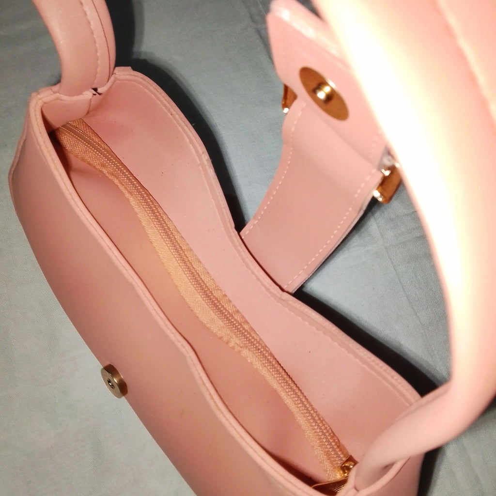 pink buckled handbag