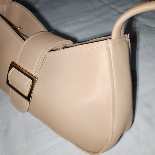 beige buckled handbag