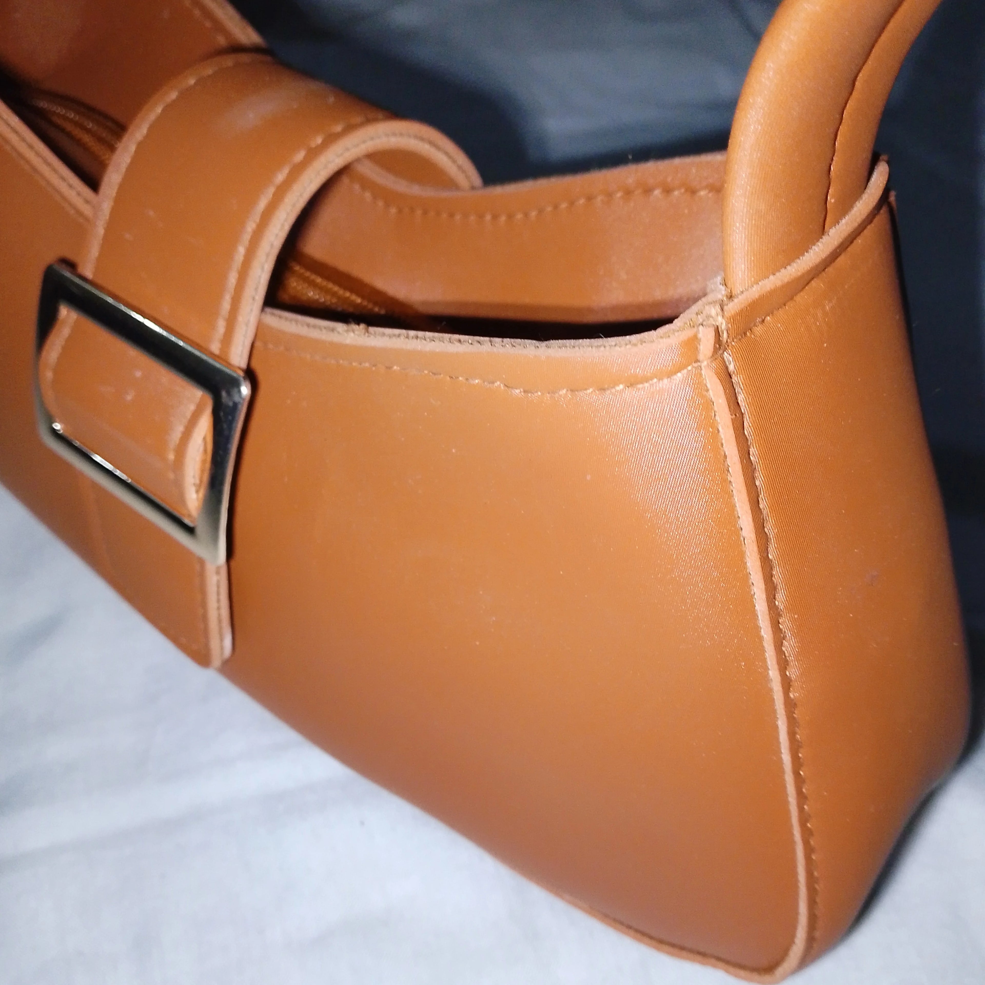 brown buckled handbag