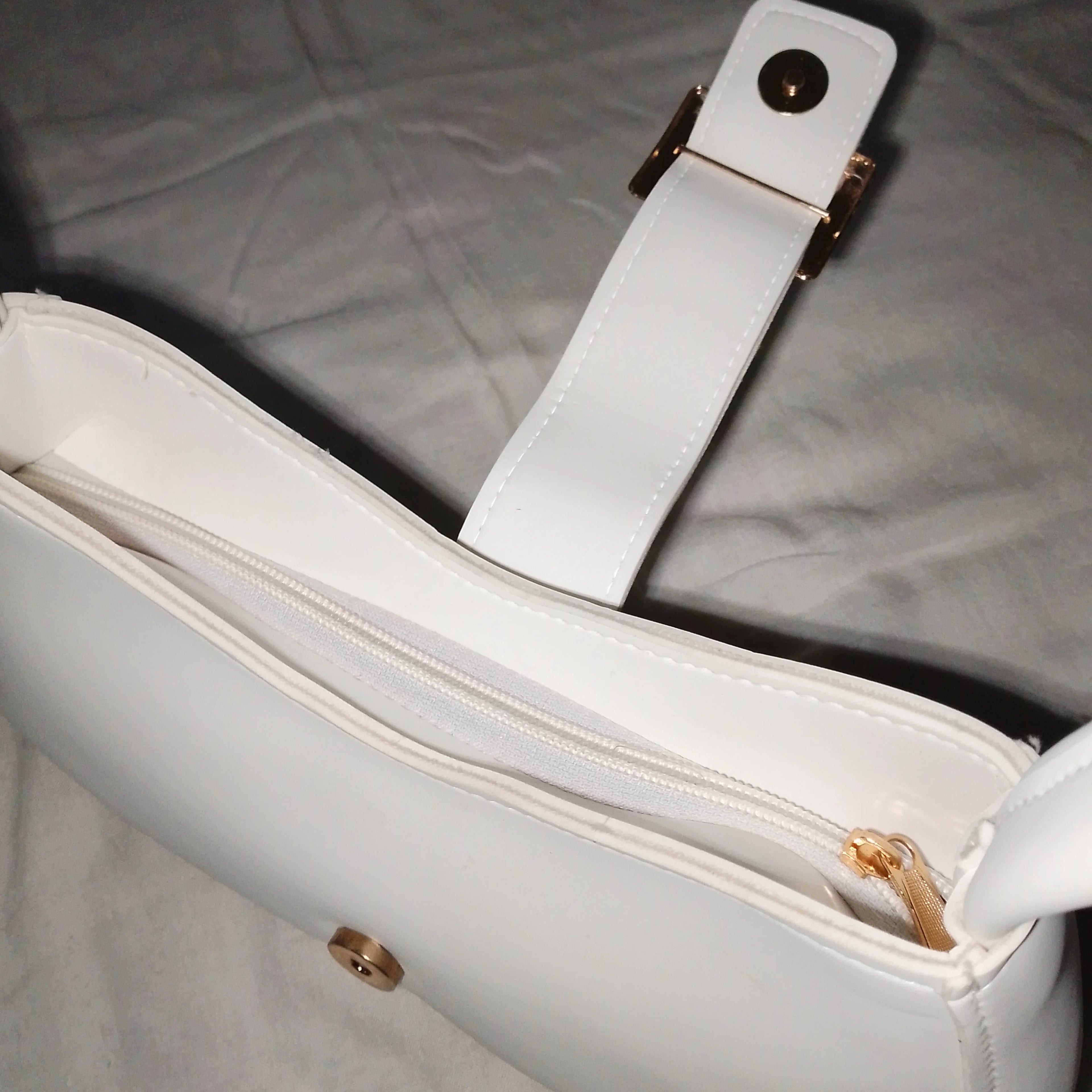 buckled white handbag