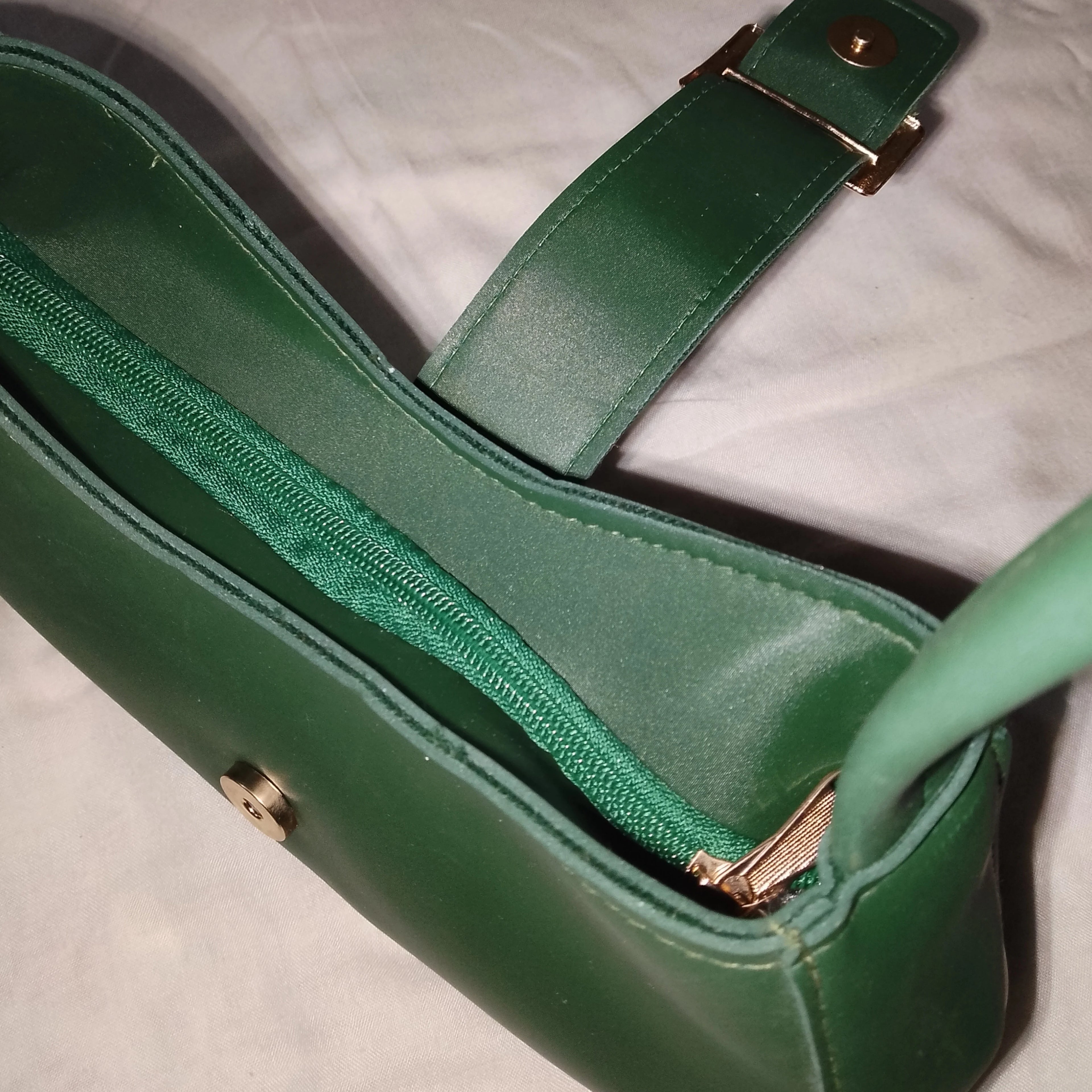 green buckled handbag