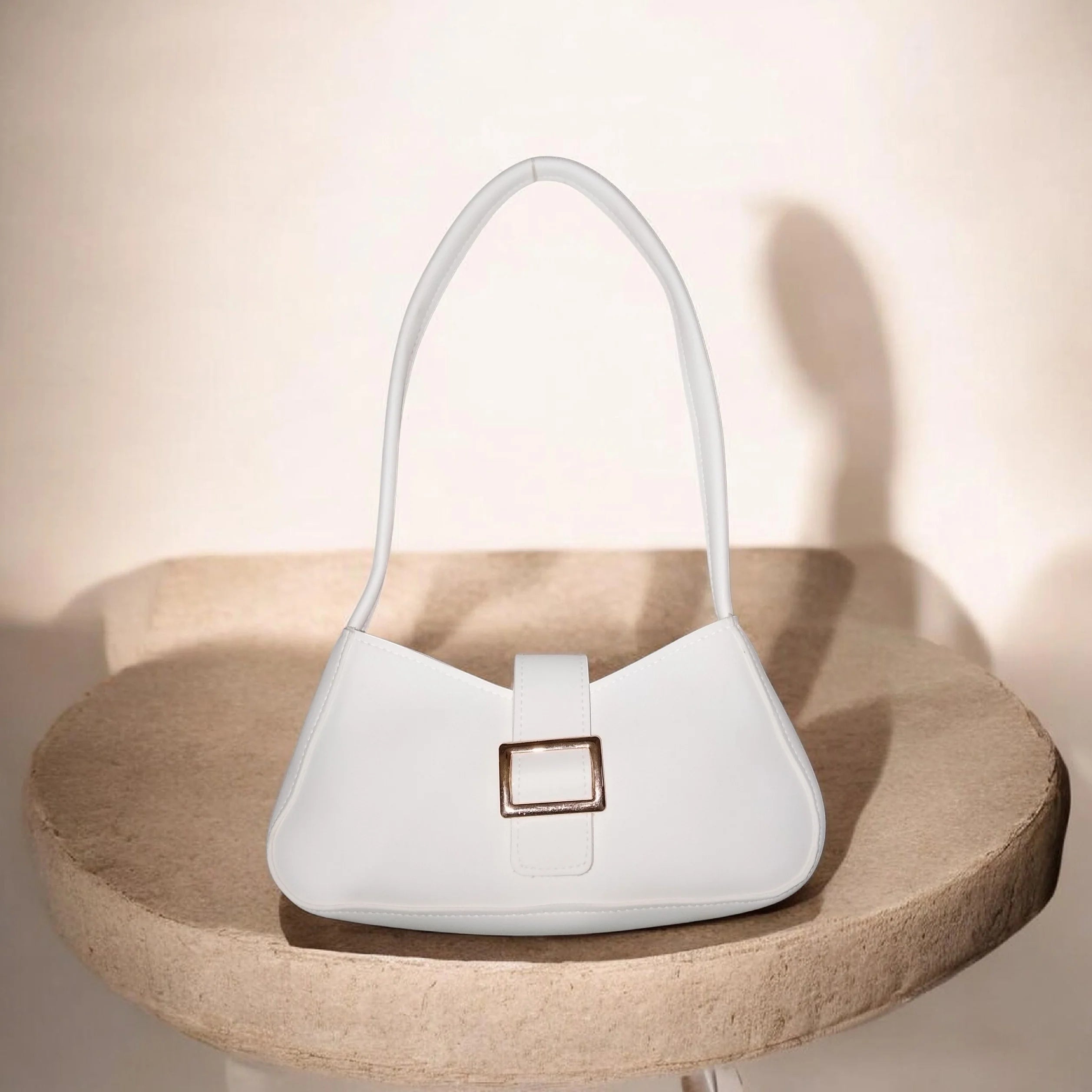 buckled white handbag