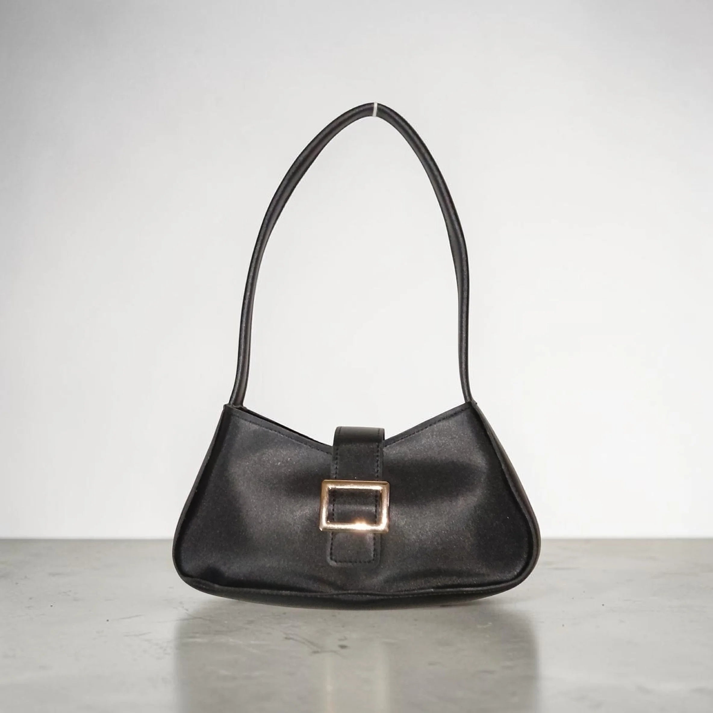 black buckled handbag