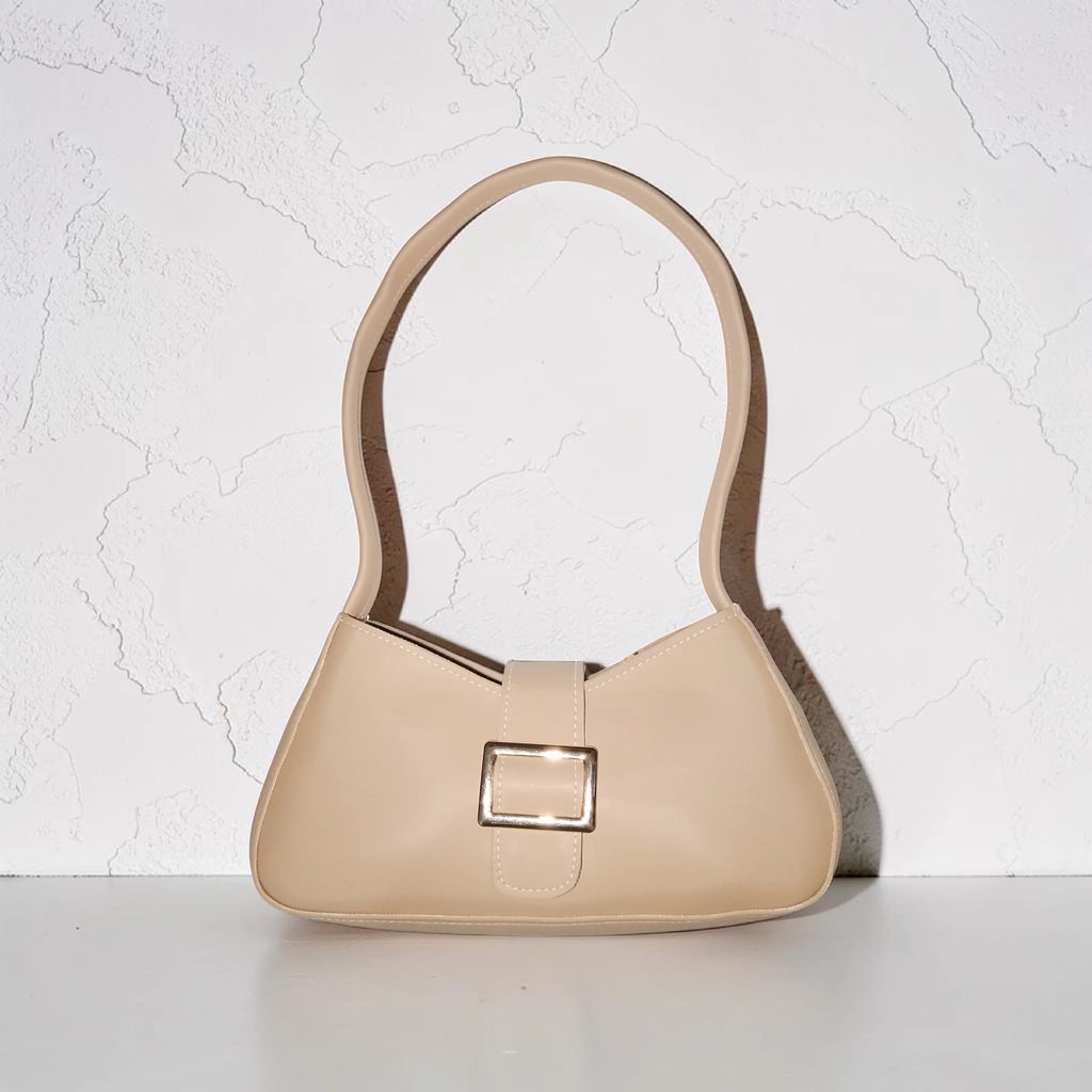 beige buckled handbag