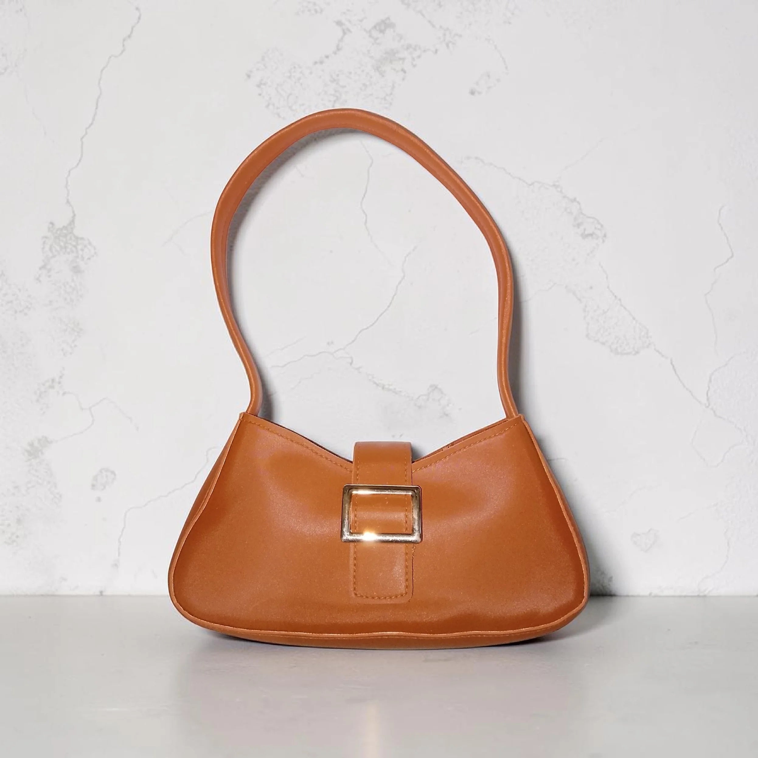 brown buckled handbag