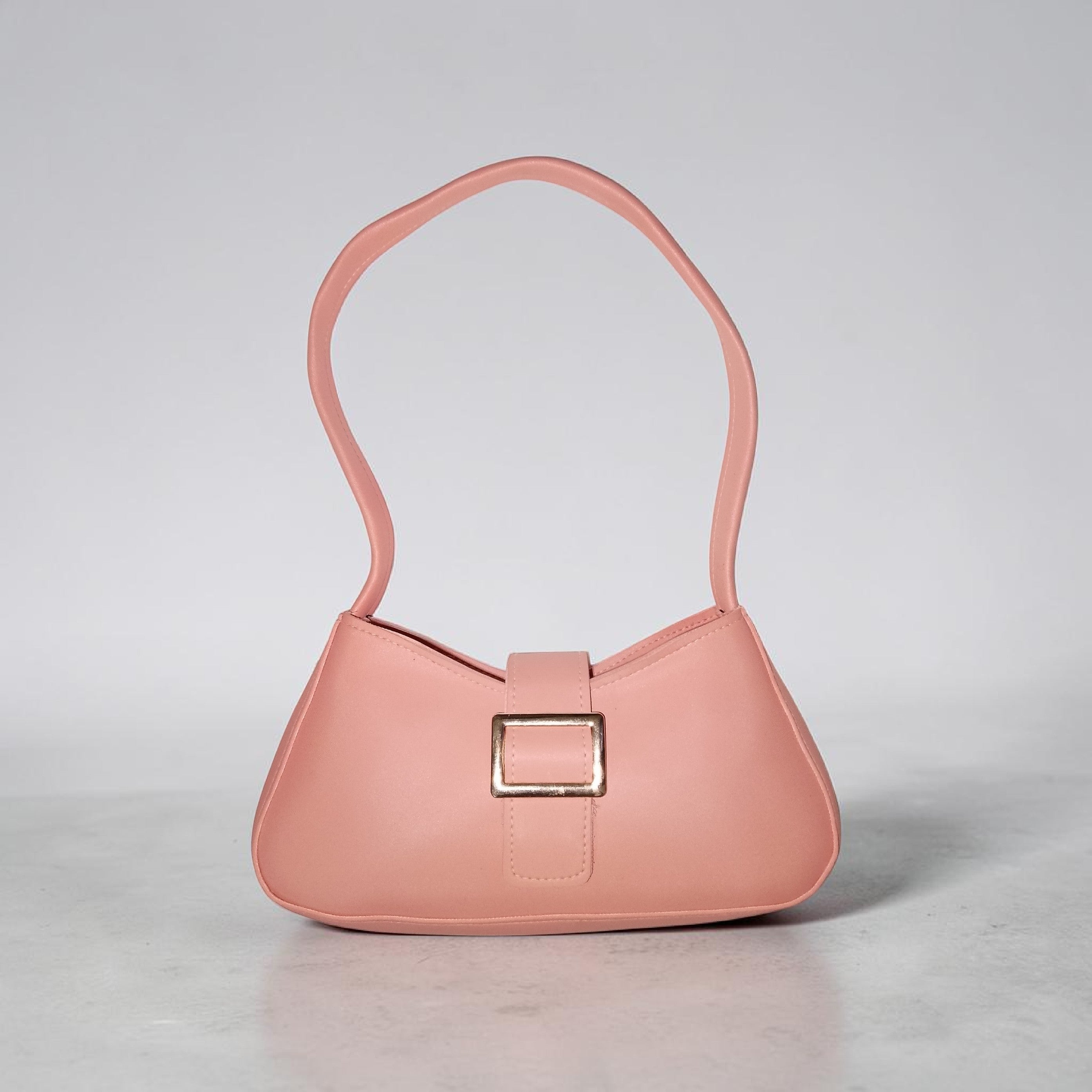 pink buckled handbag