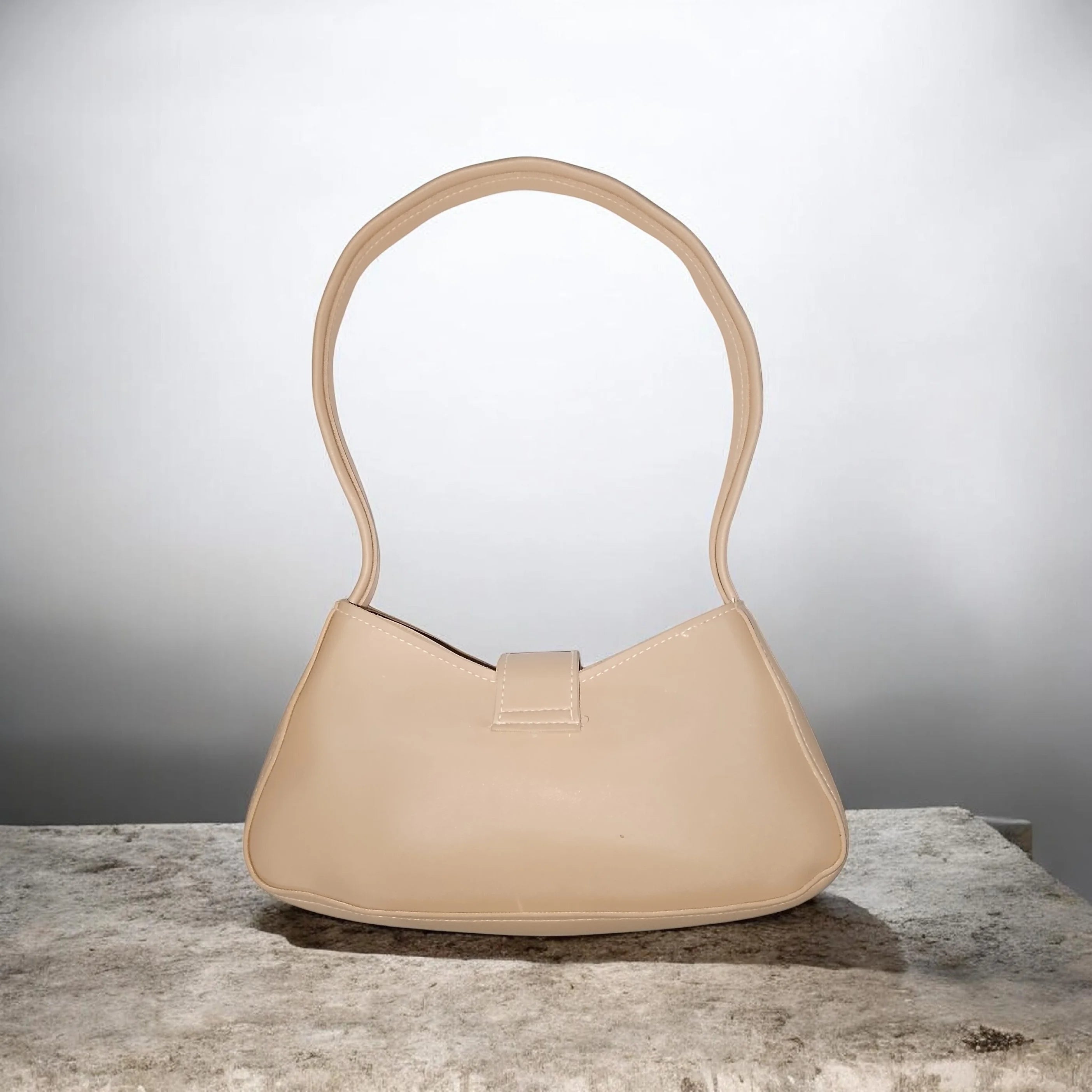 beige buckled handbag