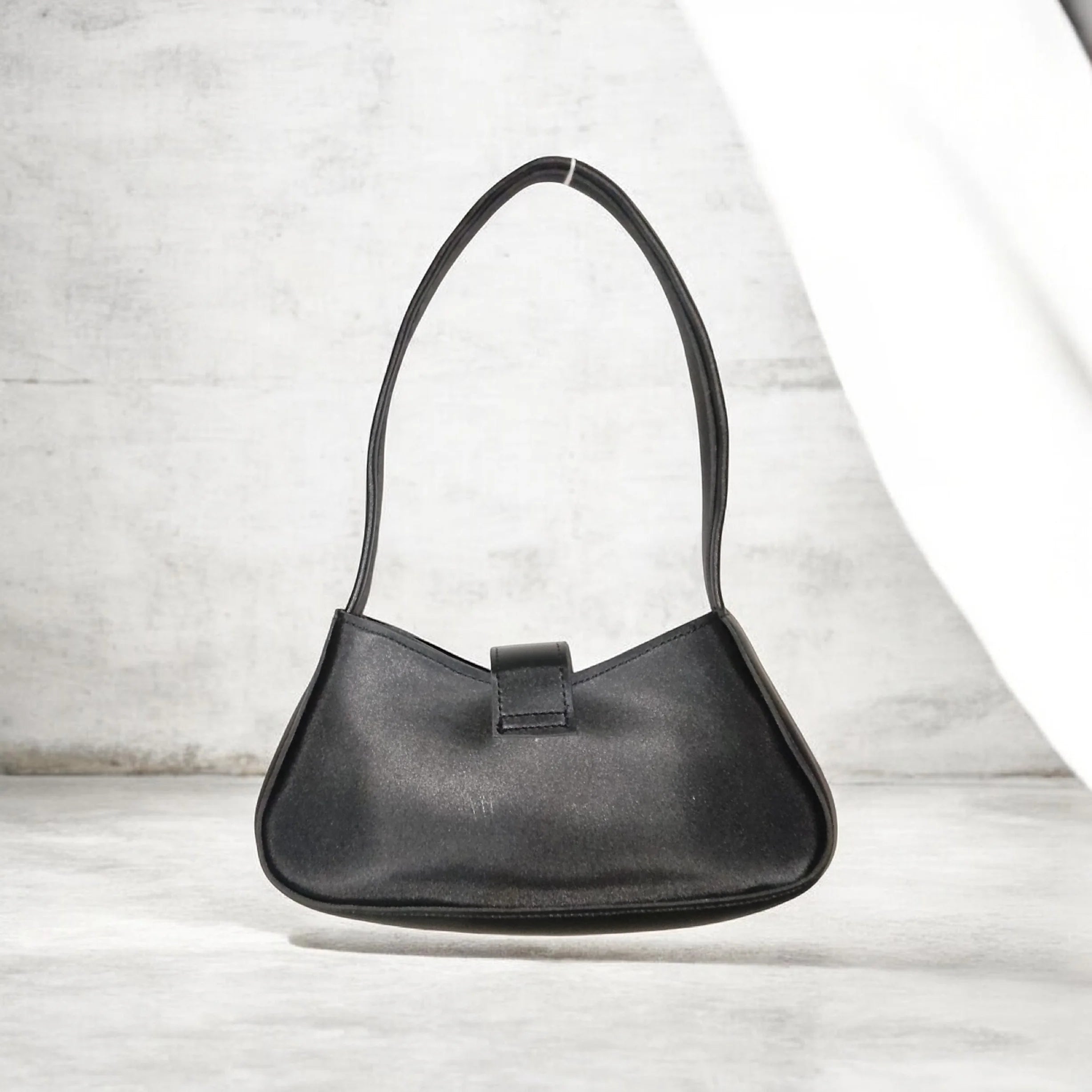 black buckled handbag